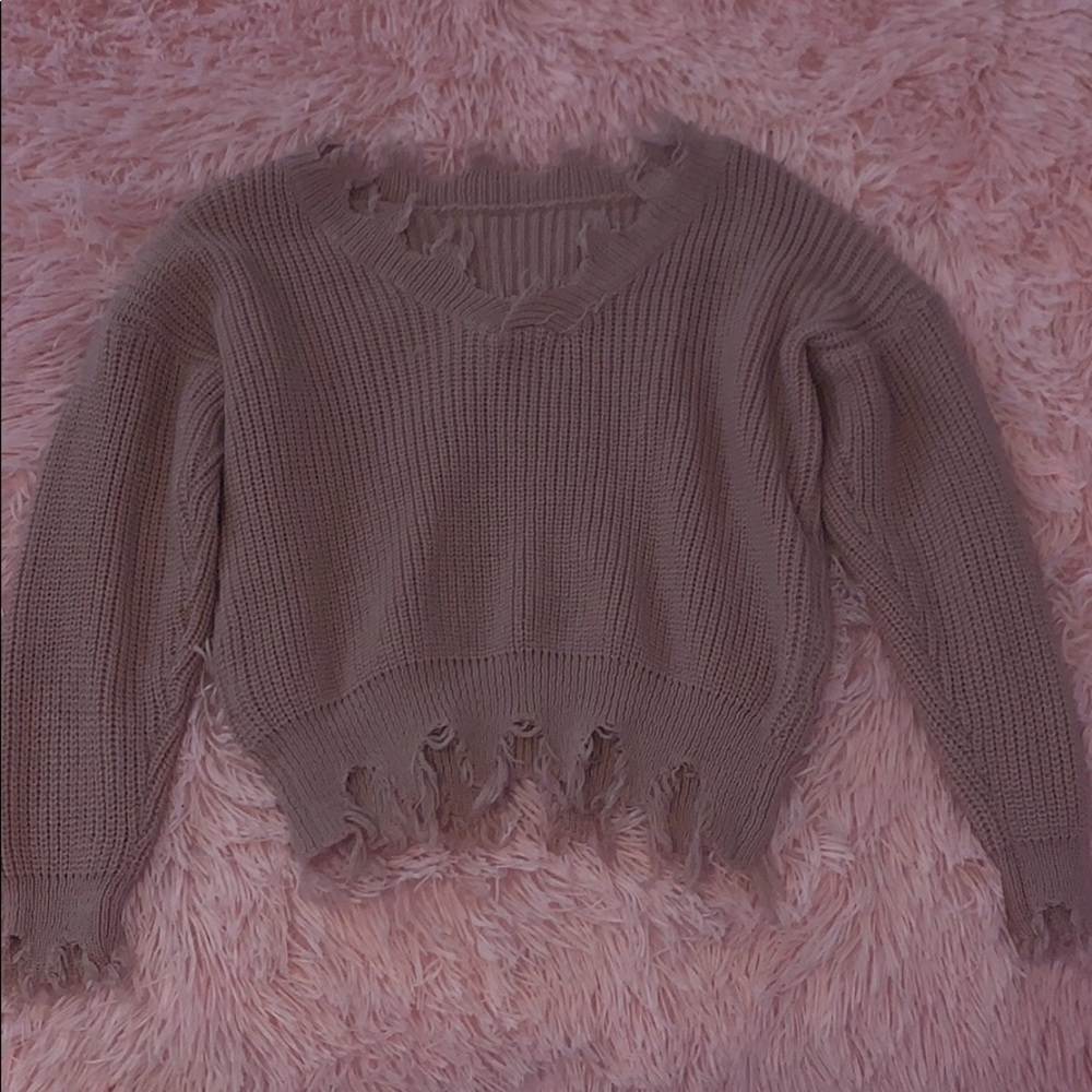 ripped cardigan sweater.